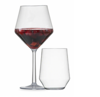 A Siesta Acrylic Glass Clear by Zwiesel Fortessa, filled with red wine and fruit, stands tall beside a shorter empty BPA-free glass on a white background.