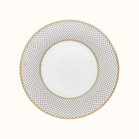 The Mottahedeh/Robert Haviland Home Dinnerware- Gold is a round white plate featuring a wide, intricate gold and gray geometric rim and a thin gold edge, shown from above against a plain background.