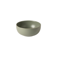 A small, round ceramic bowl in light green from the Pacifica Dinnerware Artichoke collection by Casafina/Costa Nova features a smooth, subtly speckled surface that highlights the refined elegance of Costa Nova tableware. Displayed on a white background, this luxury bowl adds understated sophistication to any setting.