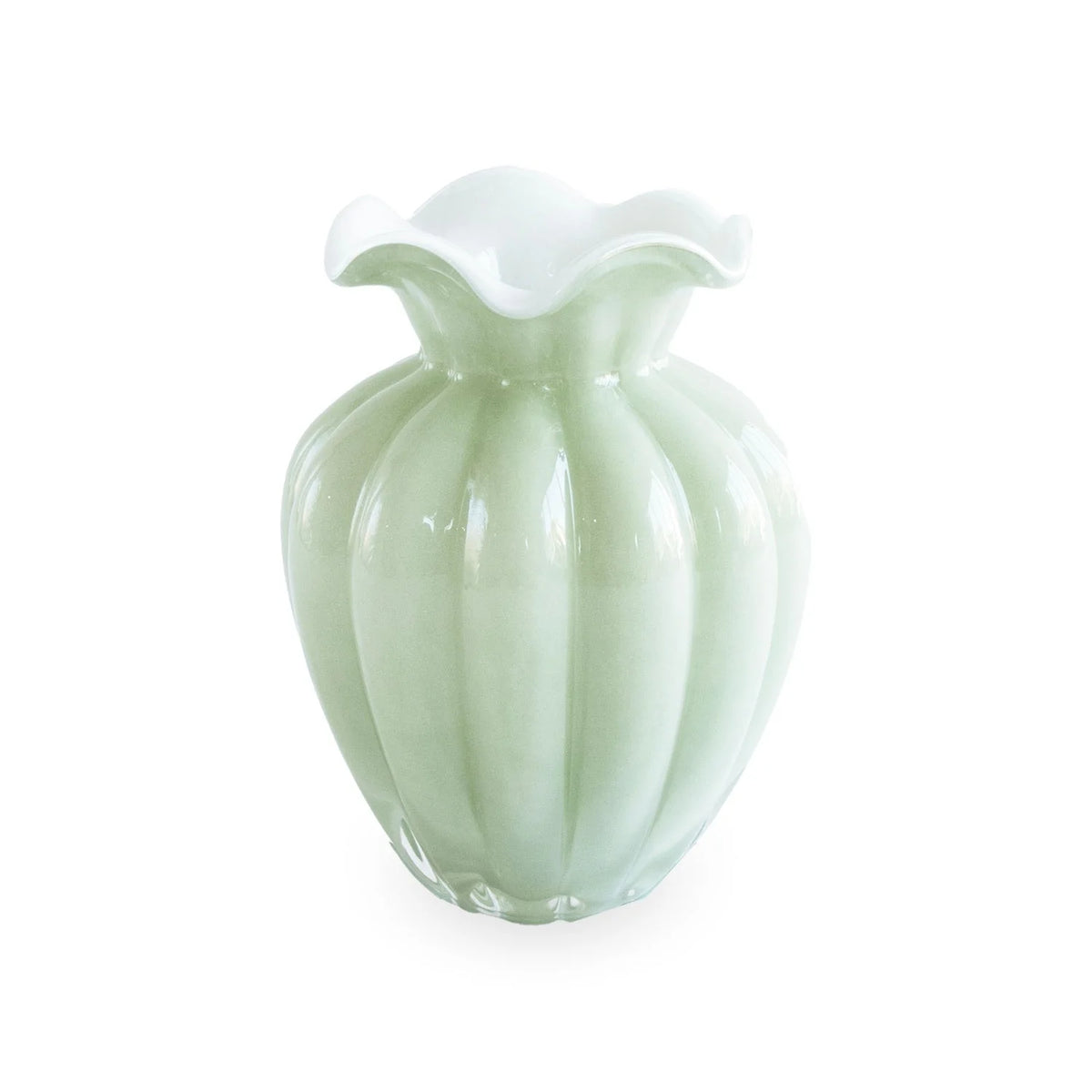 A pale green, ribbed Beatriz Ball Glass Vento Vase Pistachio - Medium with a glossy finish and a fluted, wavy white rim, set against a plain white background.