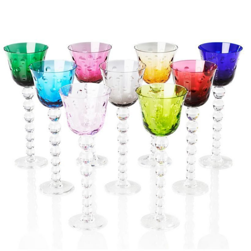 Nine Saint-Louis Bubbles Hock Stemware glasses, featuring textured bubble patterns and clear spherical stems, are arranged in rows on a white background. The set includes vibrant green, blue, pink, red, yellow, and purple colors.