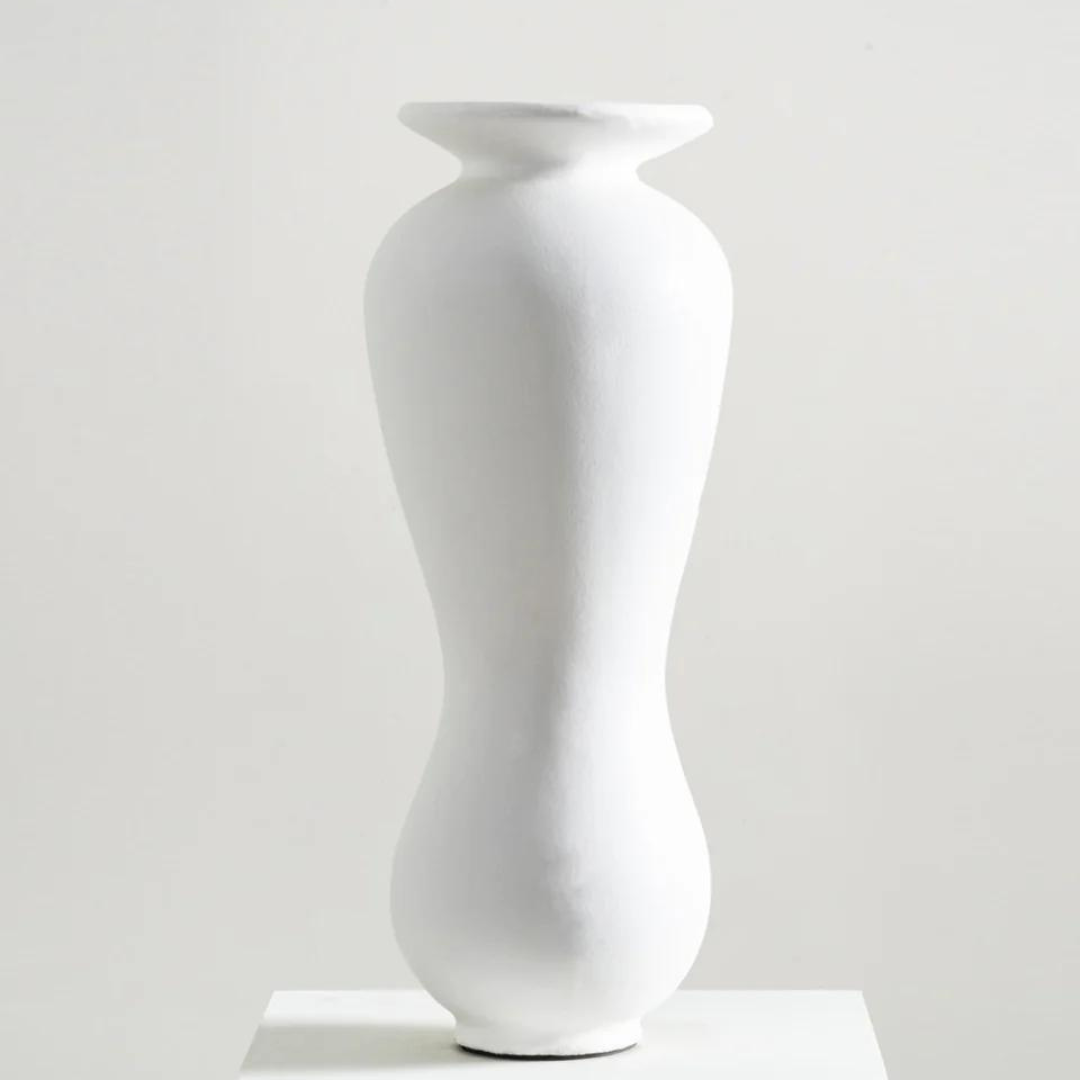 The Buchanan Vase - White is displayed here on a pedestal. 