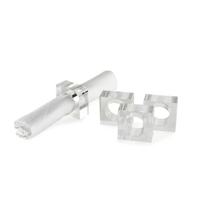 The Tizo Lucite Cube Napkin Ring Set of 4 features modern geometric designs with rectangular shapes and circular cutouts, making it a stylish choice for contemporary table decor.