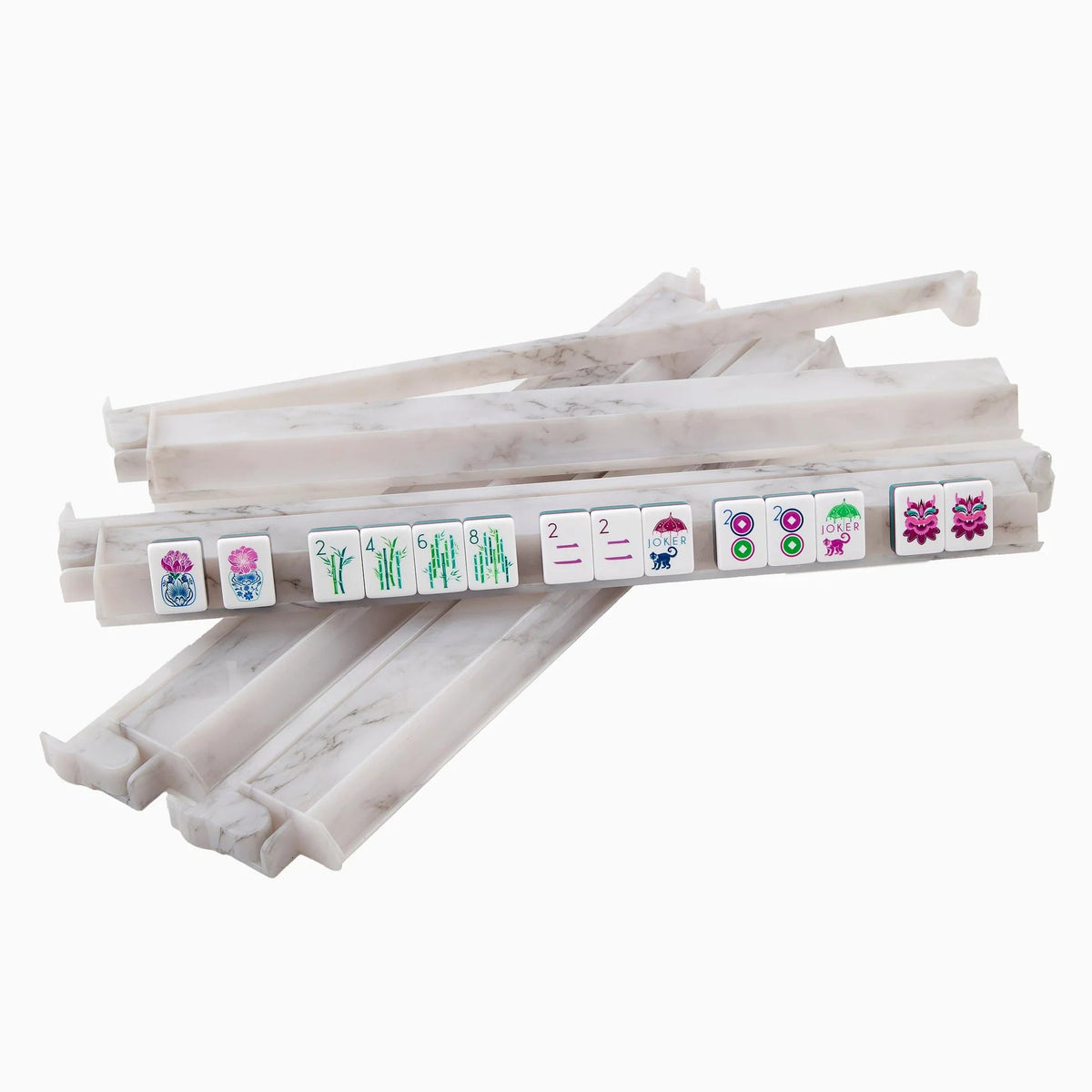 Four white marbled Carrara Mahjong Rack & Pusher Sets from Oh My Mahjong hold several colorful mahjong tiles displaying various symbols and numbers, all arranged in a row on a white background.
