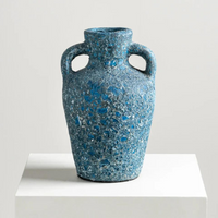 The Cavern Vase - Ocean is displayed here on a pedestal. 