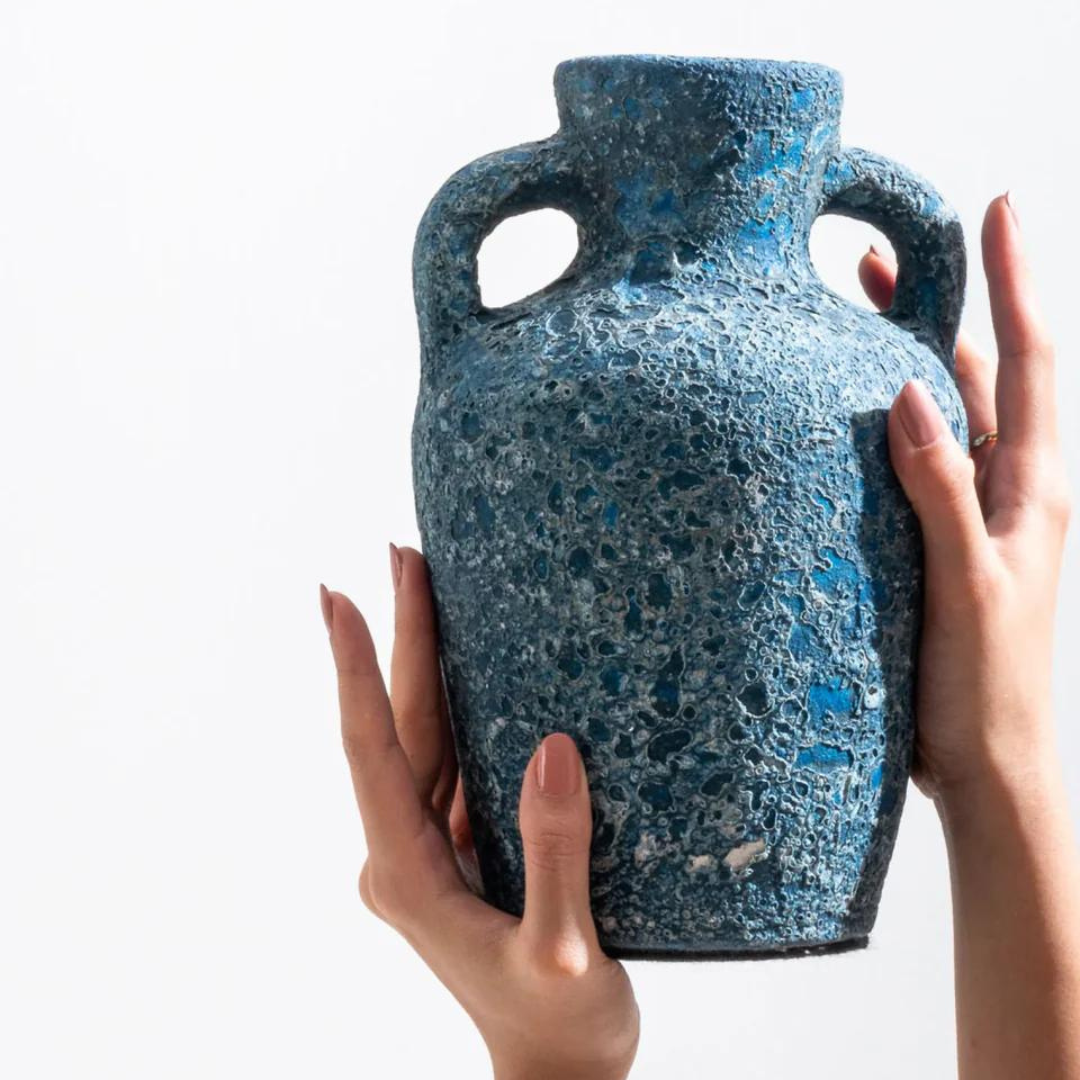 The Cavern Vase - Ocean is shown here being held by two hands. 