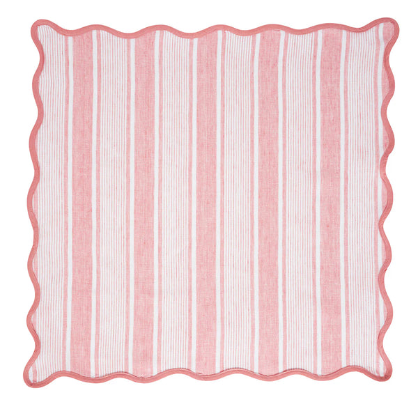 The Juliska Cabana Stripe Napkin Set of 4 in Coral features square cotton linen napkins with pink and white vertical stripes, a wavy pink border, and a scalloped trim, inspired by classic cabana linens.