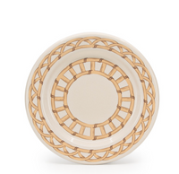 The Domino Wicker Dinnerware Set of 4 - Almond by Crow Canyon Home features round ceramic plates with a beige background and light brown interwoven bamboo-inspired patterns, evoking classic wicker dinner plate designs.
