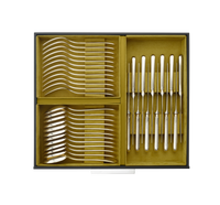 An open Christofle Silver Care Storage Chest 108 or 120 pieces - 10 Modules with velvet-lined compartments containing rows of silver forks, spoons, and knives.