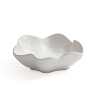 The Alto Ceramic Condiment Bowl by Zodax features an irregular wavy rim and organic shape, making it a striking, modern white ceramic piece that stands out as tableware or décor against a plain background.