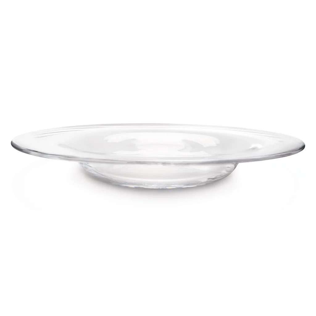 The Simon Pearce Celebration Platter is a clear, round glass plate with a shallow center, shown from the side against a white background.