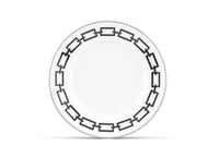 A Catene Nero dinner plate by Ginori 1735 features a black geometric chain-link pattern around the rim on white ceramic, displayed against a white background.