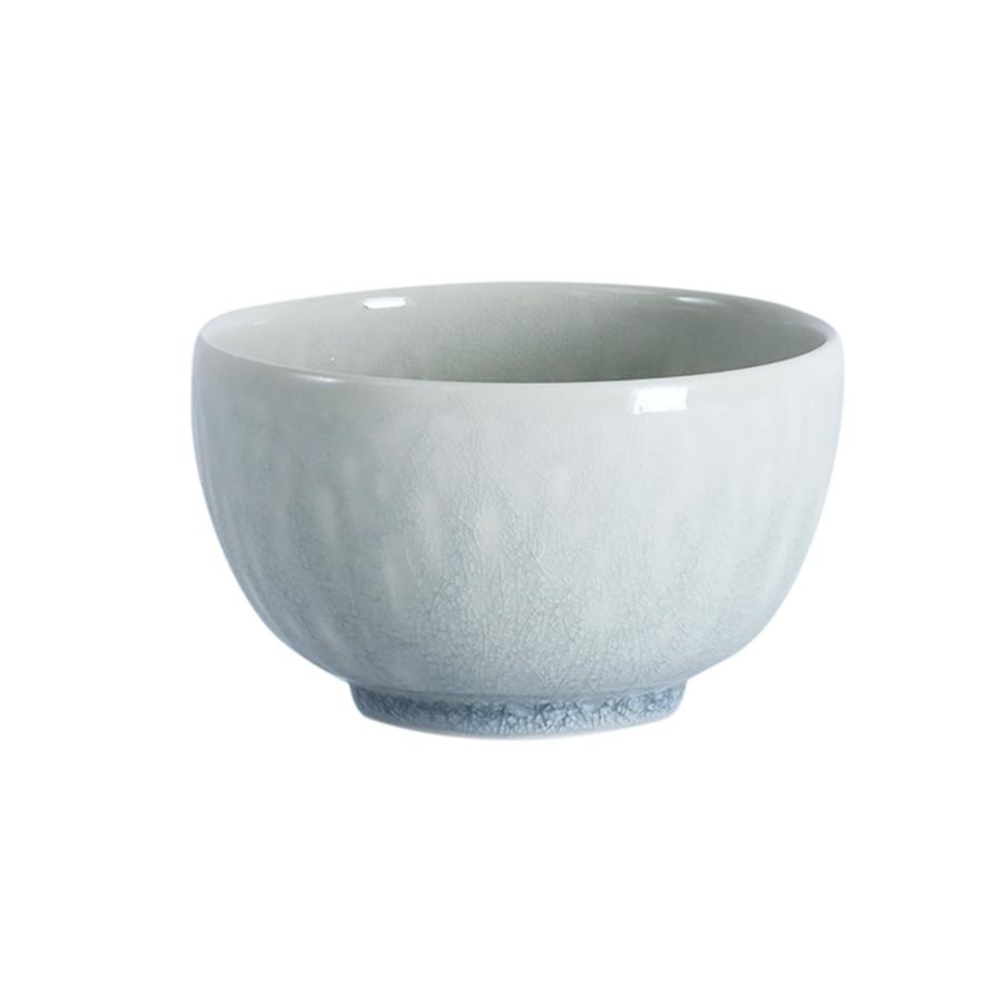 Round, pale blue Tourron Opale Fruit Bowl from Lunares featuring a subtle, cracked Opale Blue Grey glaze finish.