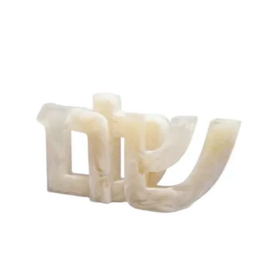 A translucent, cream-colored Shalom Sculpture - Alabaster in the shape of the Hebrew letters for Shalom.