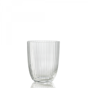The Nason Moretti Idra Tumbler Rigadin is a clear glass with vertical ribbed lines, shown empty on a reflective surface and set against a plain white background.