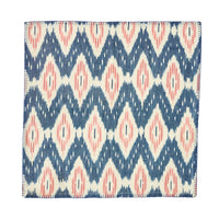 The Ikat Napkin - Set/4 by Juliska features a geometric blue, white, and blush pattern with diamonds and zigzags—perfect for bringing an island-inspired touch to your table.