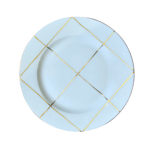 A Marie Daâge Trame Blanc white porcelain plate featuring a decorative gold grid pattern along the rim, set against a plain white background.