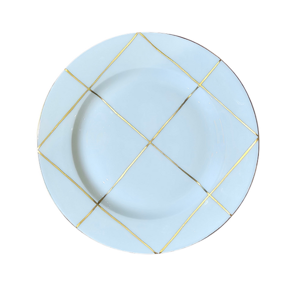 A Marie Daâge Trame Blanc white porcelain plate featuring a decorative gold grid pattern along the rim, set against a plain white background.