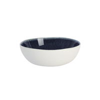 The Maguelone Midnight Blue Dinnerware bowl by Jars - Rosenthal features a smooth white exterior and glossy dark blue interior, handcrafted and displayed against a white background—an elegant piece for any artisanal dinnerware set.
