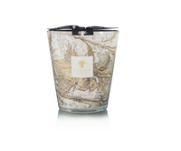 The Leaves Nais Candle by Baobab is a luxury marbled glass scented candle with white, beige, and gold swirls, topped with a black ribbon and featuring a white and gold Baobab Collection label on the front.