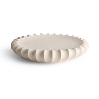 The Phoebe Bowl 15″ by FlowDecor Inc. is a round, off-white ceramic piece with a smooth surface and wavy edge—perfect as a catch-all for keys or jewelry, photographed on a plain white background.