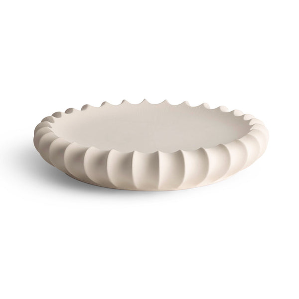 The Phoebe Bowl 15″ by FlowDecor Inc. is a round, off-white ceramic piece with a smooth surface and wavy edge—perfect as a catch-all for keys or jewelry, photographed on a plain white background.