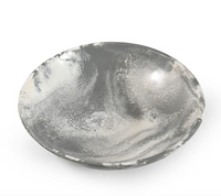 The Siler Resin Bowl by Go Home is a round, shallow serving vessel with a smooth finish and marbled gray-and-white swirls inside and out, displayed against a plain white background.
