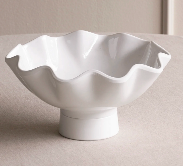 The Beatriz Ball Vida Havana Carola Pedestal Bowl White - Small features a wavy, ruffled edge and sits elegantly on a round pedestal, making it a stylish decorative accent for any neutral space.