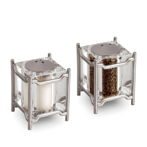 The Han Spice Jewels Set Salt & Pepper by L'Objet features square shakers with metal frames, 24k gold-plated tops, and clear bodies to display contents—elegantly packaged in a luxury gift box.
