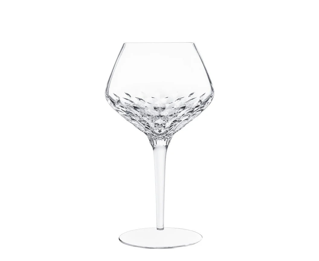 Mouthblown Folia Stemware crystal wine glass with an angled bowl featuring faceted, leaf-like cut patterns and a slender stem.