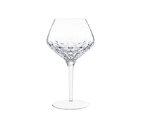 Mouthblown Folia Stemware crystal wine glass with an angled bowl featuring faceted, leaf-like cut patterns and a slender stem.