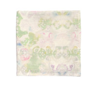 The Kim Seybert Giverny Tablecloth in Mint & Multi is a lightweight, folded linen piece featuring a soft, symmetrical floral design with pastel watercolor hues of green, pink, yellow, and purple on white.