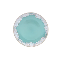 Taormina Aqua Dinnerware round plate with a smooth aqua center and a textured, distressed white rim.