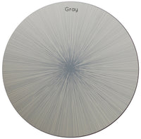 The Tisch New York Graphic Line Placemat set of 4 features a round design with a light background and a striking starburst pattern created by thin gray lines radiating from the center. Labeled “Gray” at the top, each wooden placemat is backed with cork for enhanced durability and grip. Proudly made in the USA.