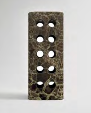 Geo Marble Vase by Greg Natale—A rectangular block of dark marble featuring nine evenly spaced circular openings arranged in a grid, standing upright against a plain gray background. This striking vase functions both as an elegant decorative piece and a functional marble vessel.