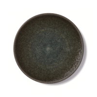 The Tourron Samoa plate by Jars - Rosenthal is a round, dark green artisan stoneware plate with a textured, slightly mottled surface, shown from above on a white background.