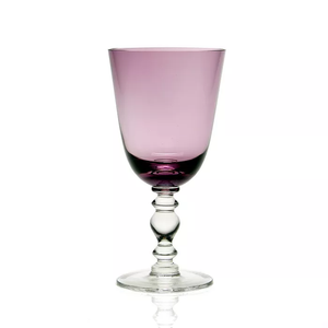 The William Yeoward Fanny Colored Country Goblet 13 oz. features a purple-tinted bowl with a clear, decorative stem and base—ideal for elegant tablescapes and shown against a plain white background.