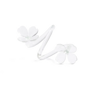 A silver ring featuring two delicate white flower designs at each end, with five petals on each flower, set against a plain white background—perfect for those who appreciate decorative tableware that brings an elegant touch to any setting.