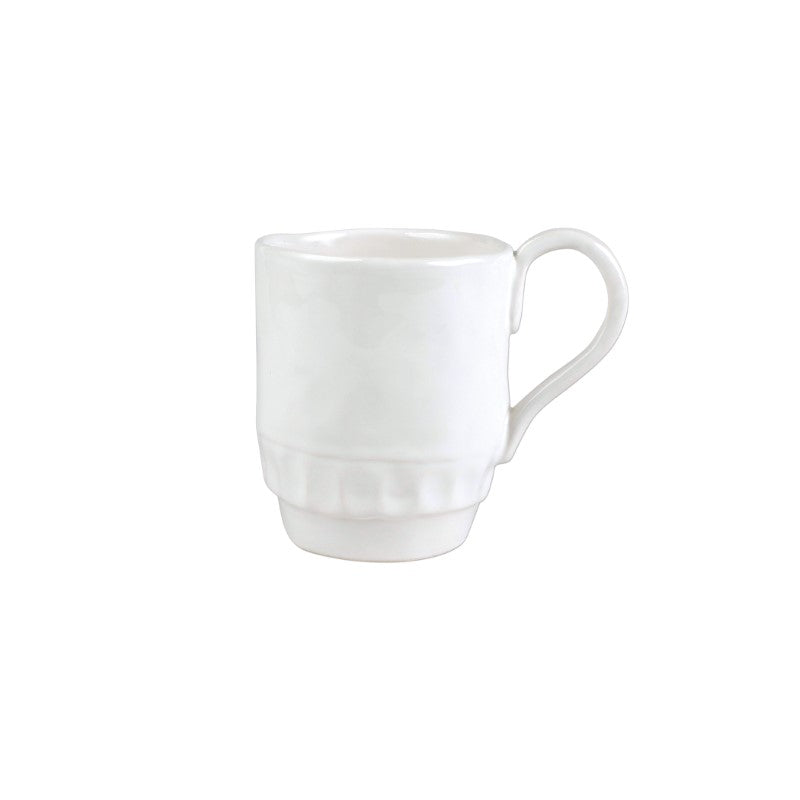 White ceramic Vietri Pietra Serena mug with a textured base and a curved handle.