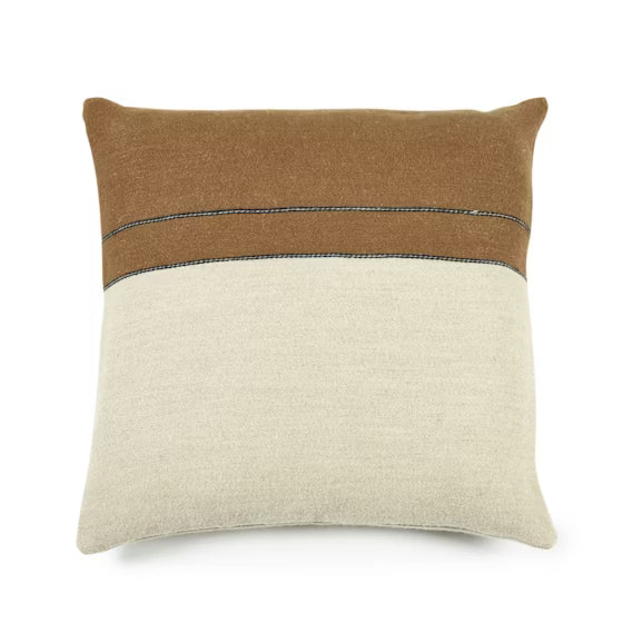 The Gus Stripe Pillow 25 x 25 by Libeco Home is an oversized square linen wool pillow with a brown top section, thin black stripe, and beige bottom, making a striking statement against a white backdrop.