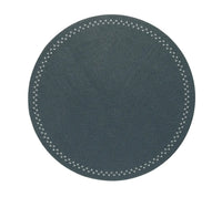 A round, dark gray placemat from the Starry Night Placemat set of 4 by Kim Seybert features a subtle texture and a white zigzag stitched border around the edge, offering both style and practicality for any tabletop setting.