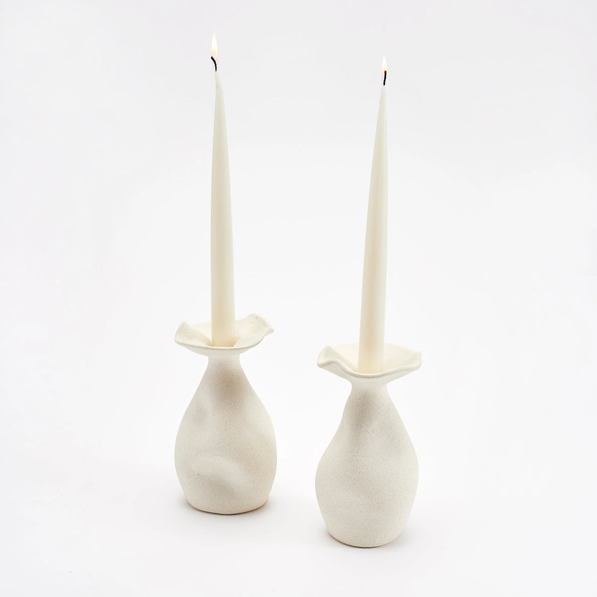 Helen candleholder set displayed her with white taper candles. 