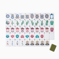 Experience the Mahjong Tiles Set - Drake by Oh My Mahjong, a luxurious collection of vibrant acrylic tiles arranged in neat rows. Each tile features intricate designs—including circles, bamboo, characters, dragons, winds, flowers, jokers, and a distinctive green tile—set against a crisp white background.