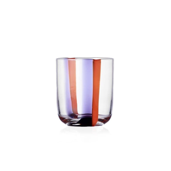 A Gesti Tumbler by Ichendorf Milano made from clear glass, featuring a vertical orange stripe and a vertical purple stripe running down its side, set against a plain white background.