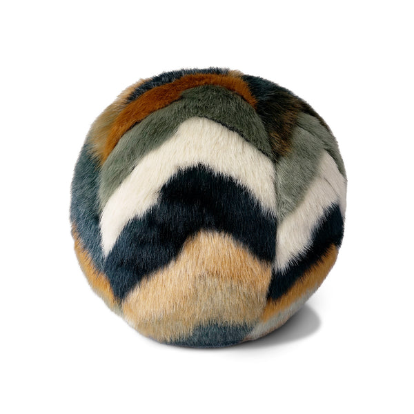 The Furdi Ball Pillow 12" by D.V. KAP / Canaan Company features plush faux fur in a chevron pattern of green, gold, white, and dark blue, bringing contemporary style to your space.