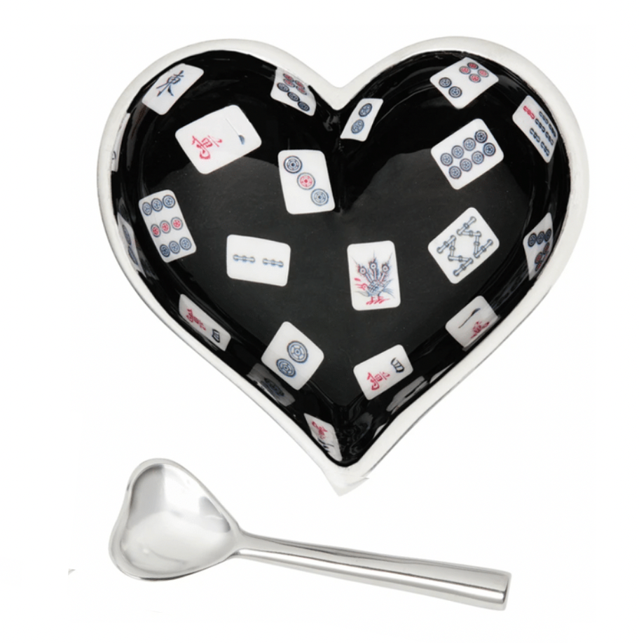 The Happy Heart Bowl With Spoon - Mah Jong by Inspired Generations is a heart-shaped bowl with a black interior and mahjong tile pattern, paired with a small silver heart-shaped spoon.