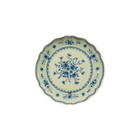 Vila Olive / Blue round plate with a scalloped edge featuring a blue floral pattern on a cream background.