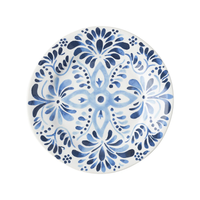 The Juliska Iberian Dinnerware is a round ceramic plate featuring an intricate blue and white floral and geometric pattern inspired by traditional hand-painted Iberian Journey cobalt blue tiles on a white background.