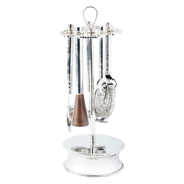 The Juliska Graham Bar Tool Set features a shiny silver stand with a strainer, stirrer, jigger, bottle opener, and a tool with a wooden handle—all neatly hanging for stylish organization.