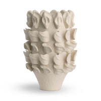 The Yvette Vase by FlowDecor Inc. is a textured off-white ceramic vase with sculpted ear and lip shapes protruding from its surface, shown against a plain white background.